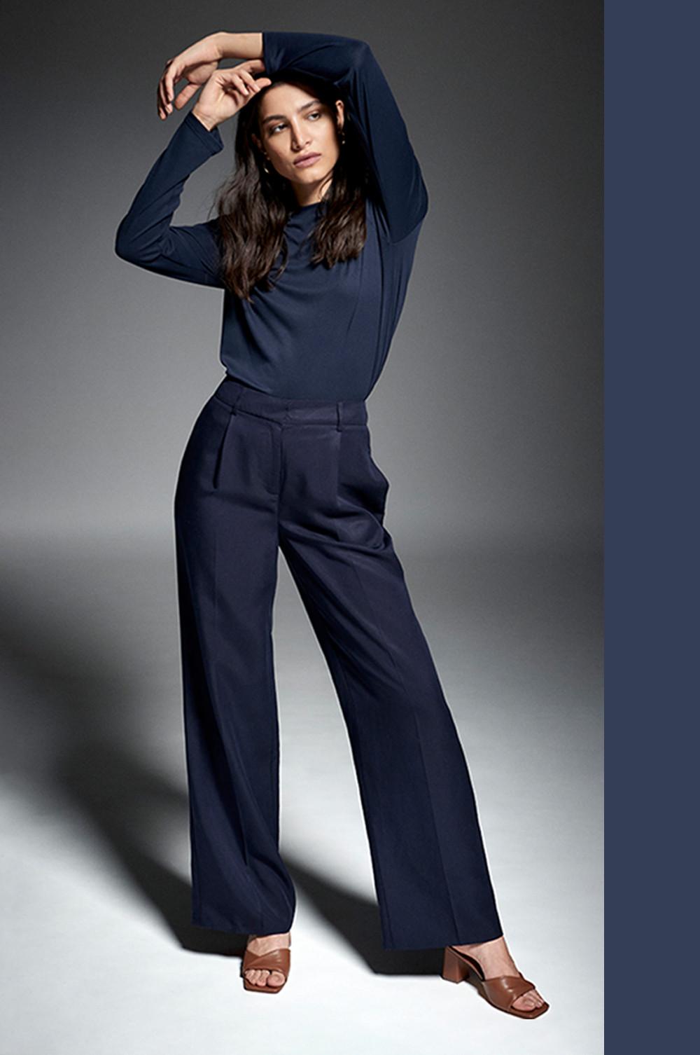 Model wears Navy wide leg trousers, with coordinating soft touch navy top